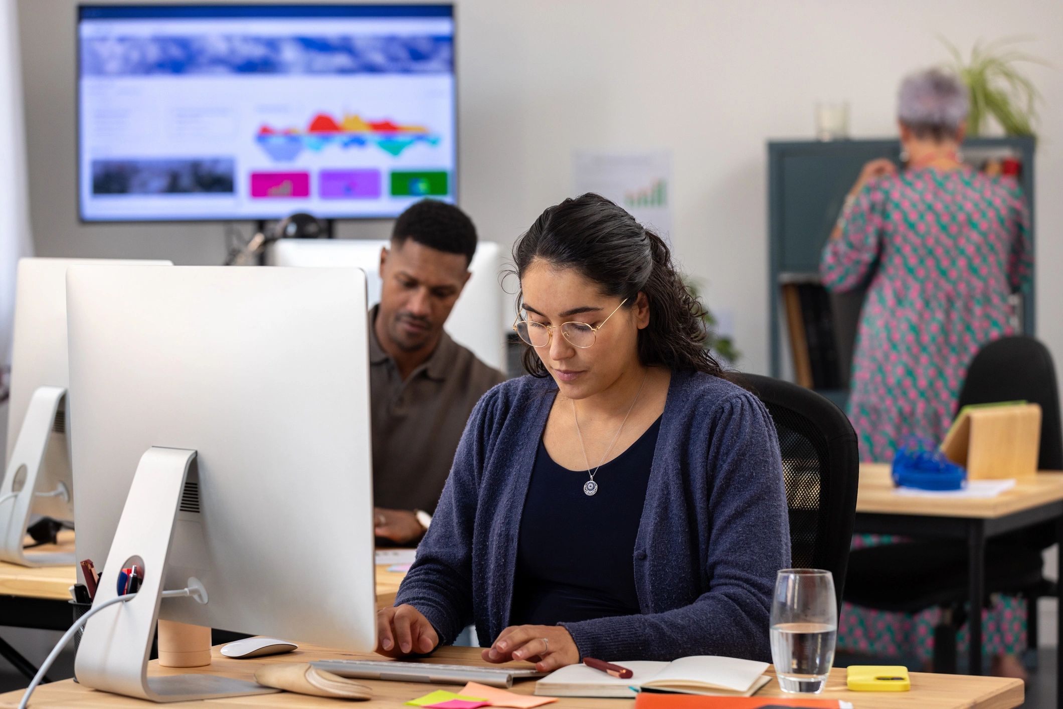 Professional working at computer in modern office