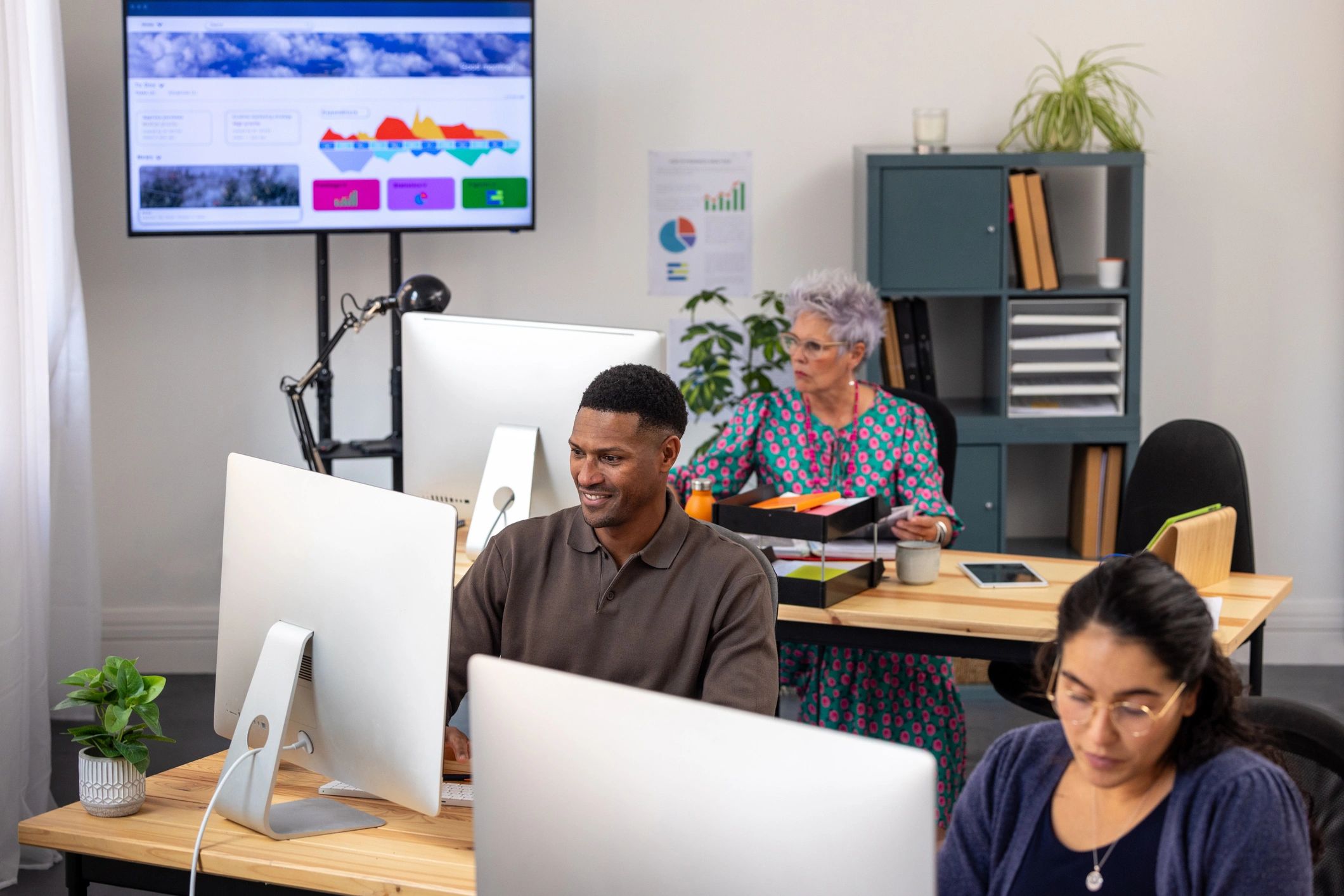 Office team working at support desk